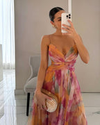 Elegant floral maxi dress for women by Harrow, featuring a vibrant floral print and flowing summer design.