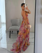 Elegant floral maxi dress for women by Harrow, featuring a vibrant floral print and flowing summer design.