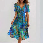 Harrow Connie floral midi dress for women with a vibrant summer floral pattern and elegant flowy design.