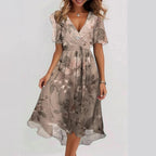 Harrow Connie floral midi dress for women, elegant summer apparel with vibrant floral pattern and flowing fabric.