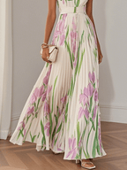 White floral maxi dress for women with pleated details, elegant summer dress by Harrow in a flowing, feminine style.