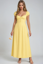 Yellow empire maxi evening gown for women, elegant formal dress by Harrow, featuring a flowing design and sophisticated style.