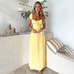 Yellow Aigerim elegant maxi evening gown for women by Harrow, featuring a flowing empire waist and formal design.