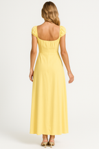 Yellow Aigerim elegant maxi evening gown for women by Harrow, featuring a flowing empire waist and formal dress design.