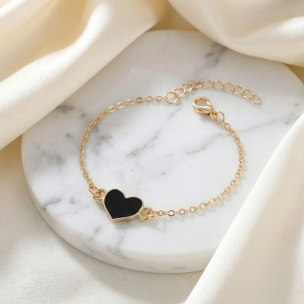 Harrow Adelaide gold heart charm bracelet for women, featuring a delicate gold chain with a heart-shaped pendant.