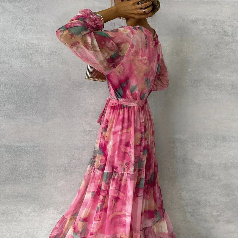 Elegant floral summer dress for women, handmade by Harrow, featuring vibrant flower patterns and a flowy design.