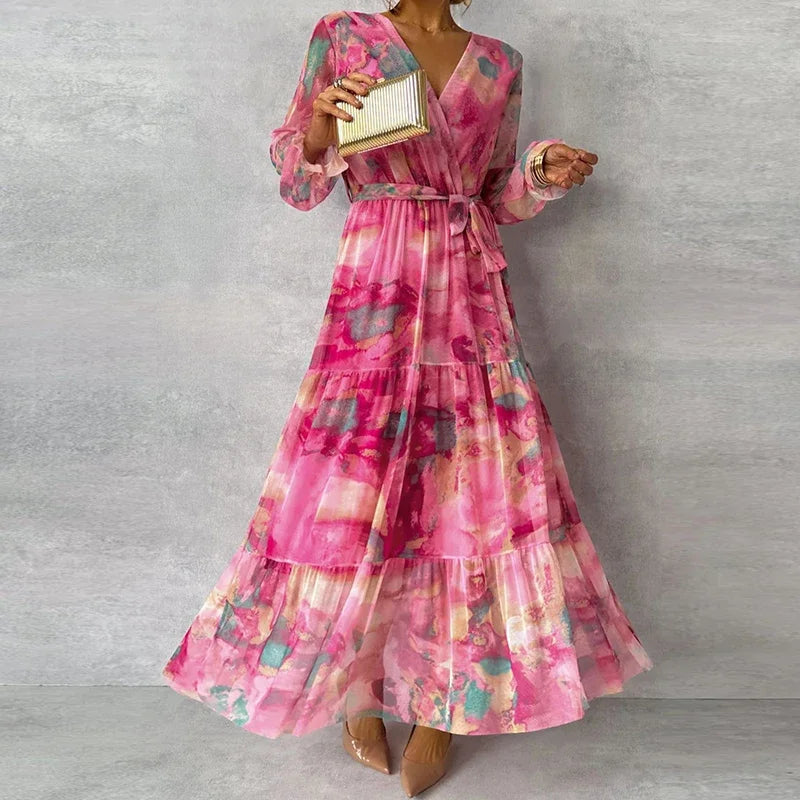 Elegant floral handmade dress for women, the Katie summer dress by Harrow, featuring vibrant floral patterns and a flowing design.