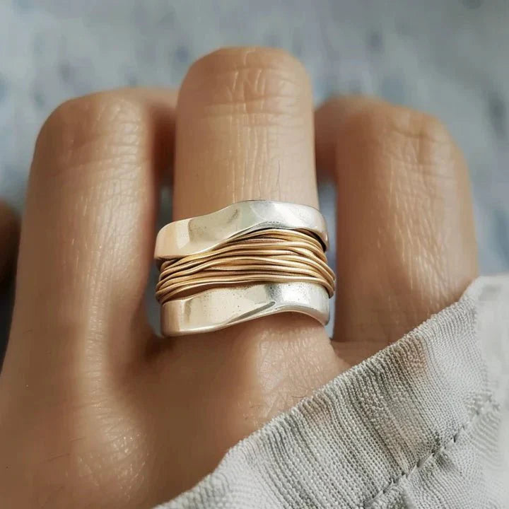 Elegant dual-tone Lumia statement ring for women by Harrow, showcasing a stylish and modern design on a white background.