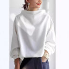 Harrow Margot high-neck soft knit top for women, shown in a close-up of the cozy, fitted design and smooth fabric texture.