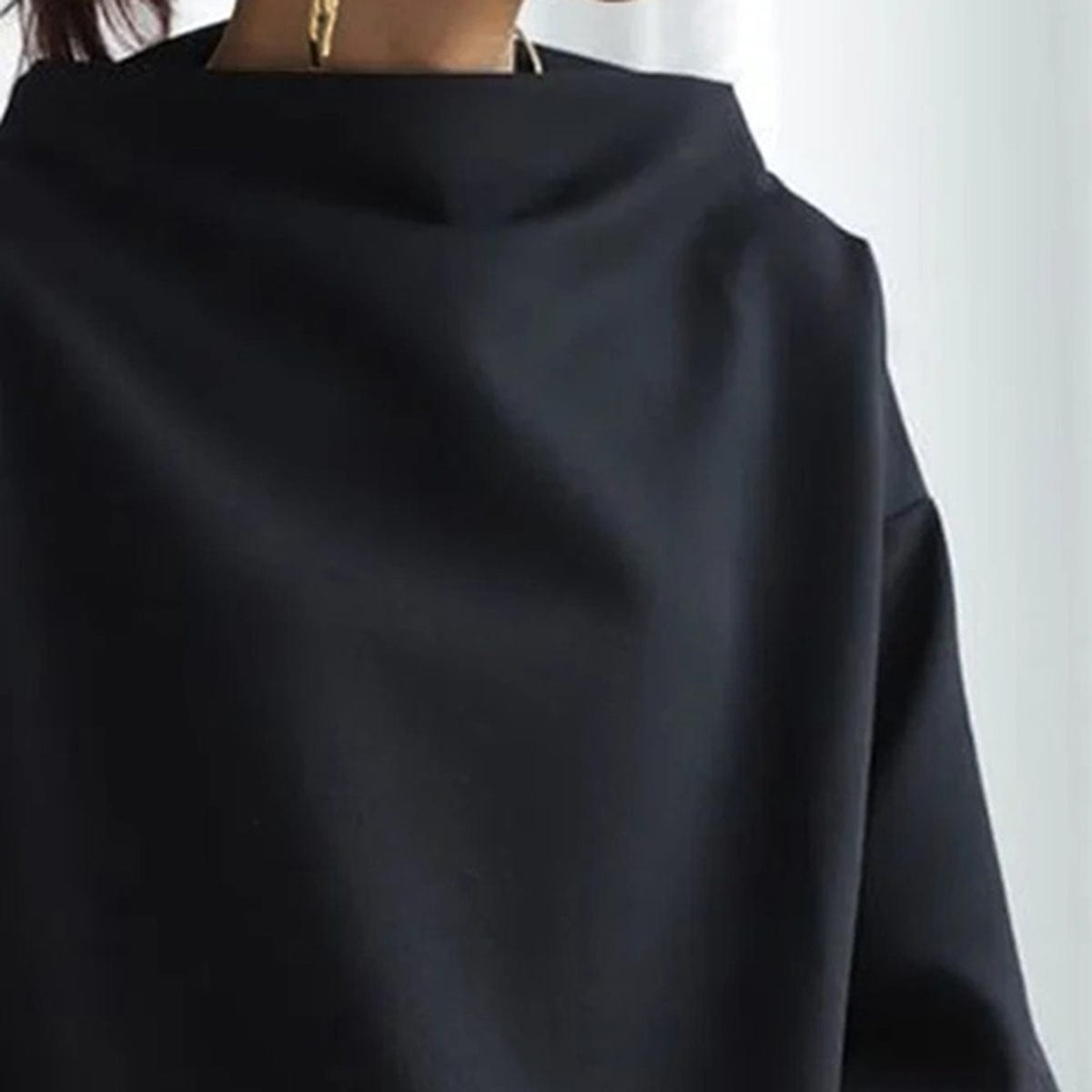 Harrow Margot high-neck soft knit top for women, shown in a close-up of the cozy, fitted fabric and stylish neckline.