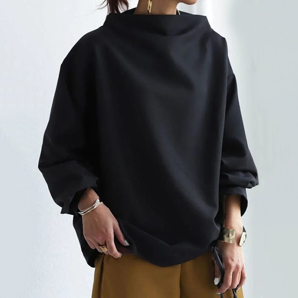 Harrow Margot high-neck soft knit top for women, featuring a cozy, fitted design in a neutral color.