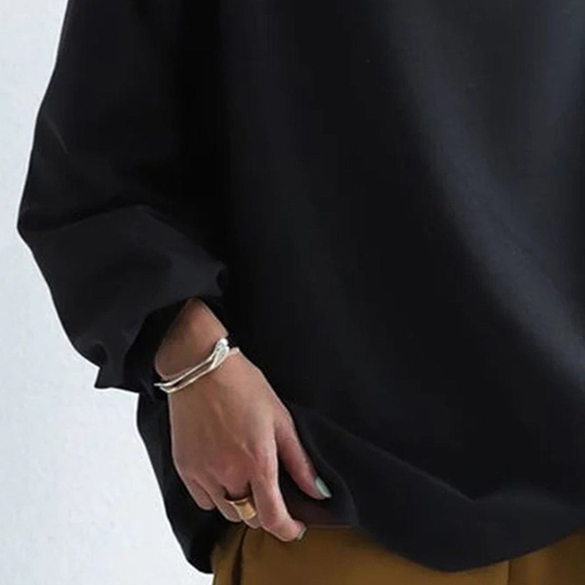 Harrow Margot high-neck soft knit top for women, featuring a cozy, fitted design in a neutral color.