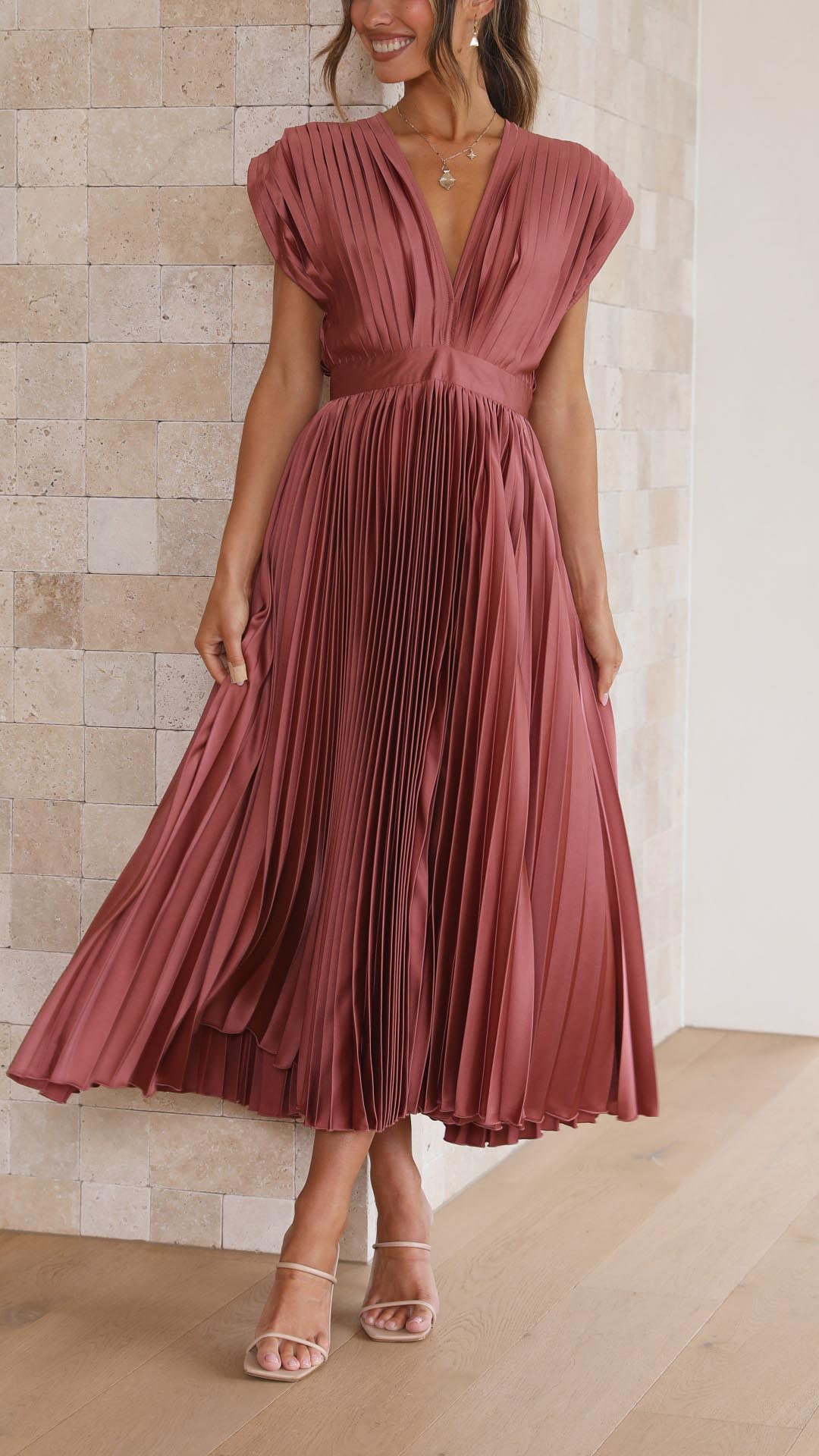 Elegant flowing maxi dress for women by Harrow featuring pleated design and a graceful silhouette.