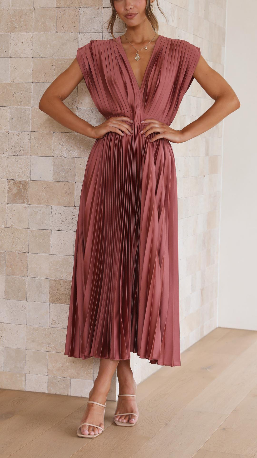Elegant flowing maxi dress for women by Harrow, showcasing pleated fabric and a graceful silhouette.