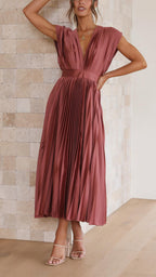 Elegant flowing maxi dress for women by Harrow, featuring pleated design and a graceful silhouette.