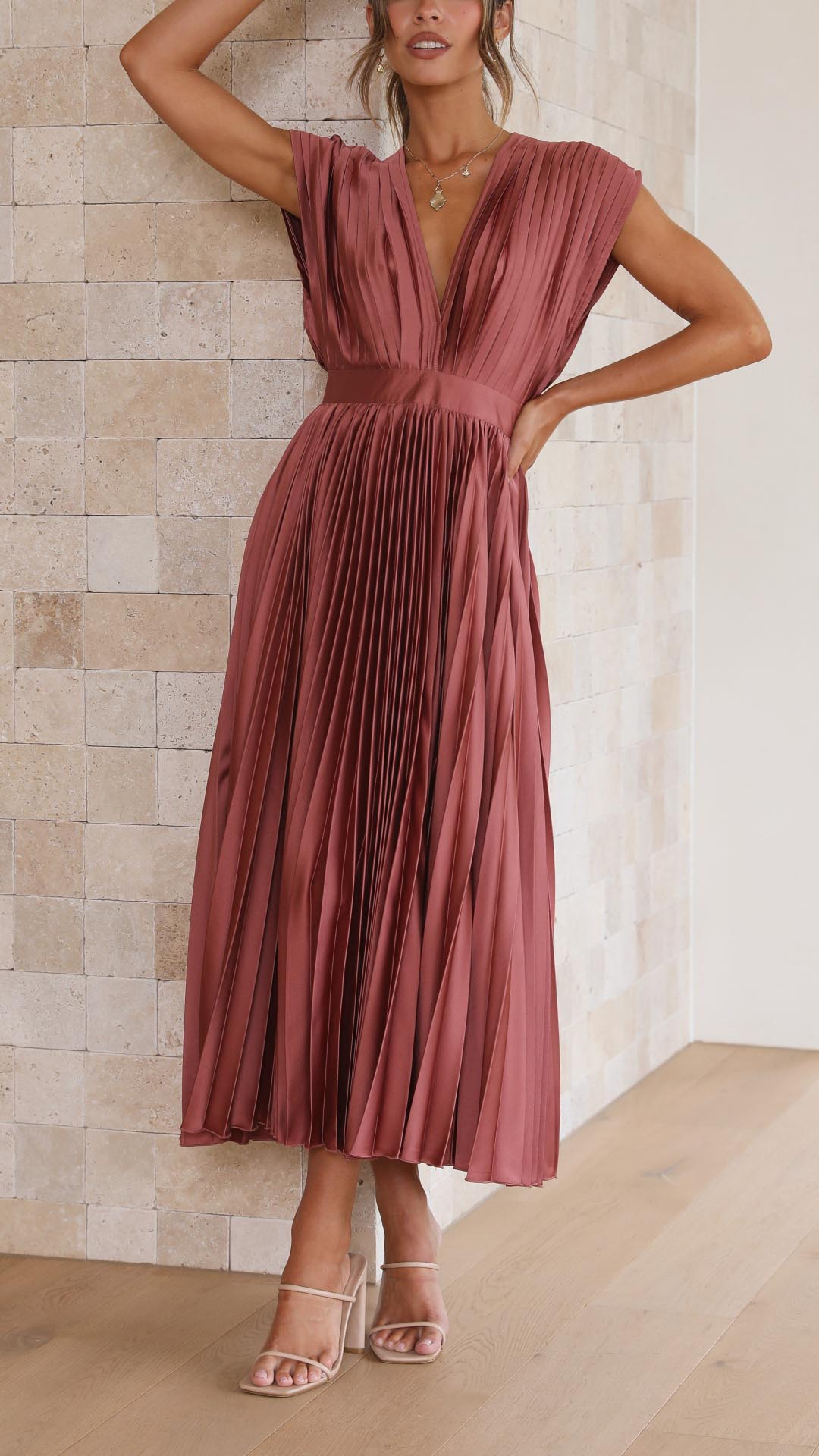 Elegant flowing maxi dress for women by Harrow, featuring pleated design and a graceful silhouette.