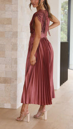 Elegant flowing maxi dress for women by Harrow, featuring pleated details and a sophisticated design.