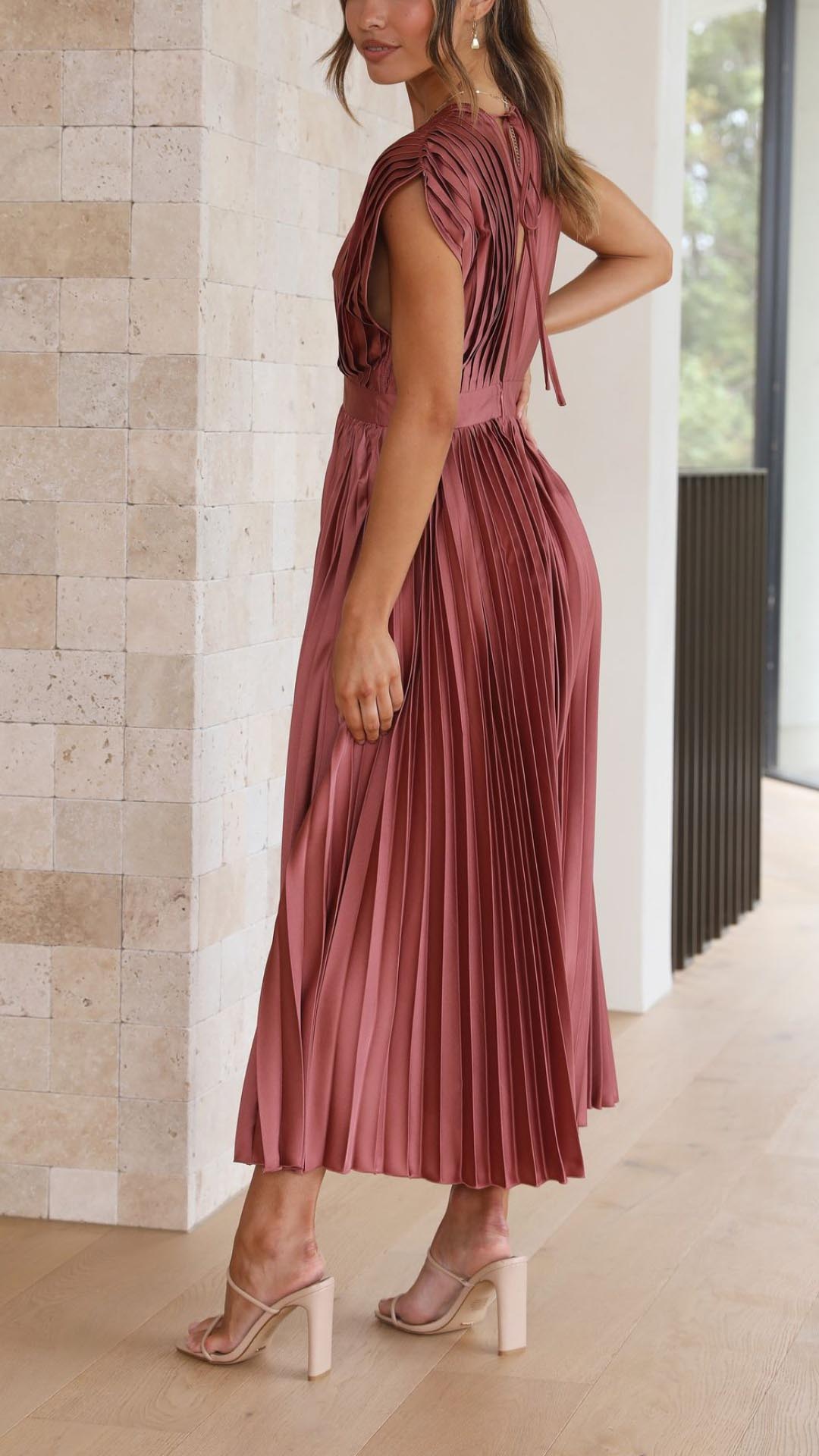 Elegant flowing maxi dress for women by Harrow, featuring pleated details and a sophisticated design.