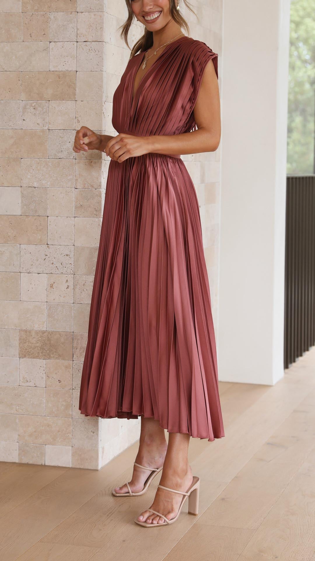 Elegant pleated maxi dress for women by Harrow, flowing and stylish with a sophisticated design in a full-length silhouette.