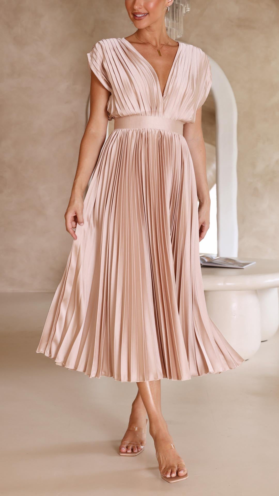 Harrow Maria elegant flowing maxi dress for women with pleated design, lightweight fabric, and a graceful silhouette.