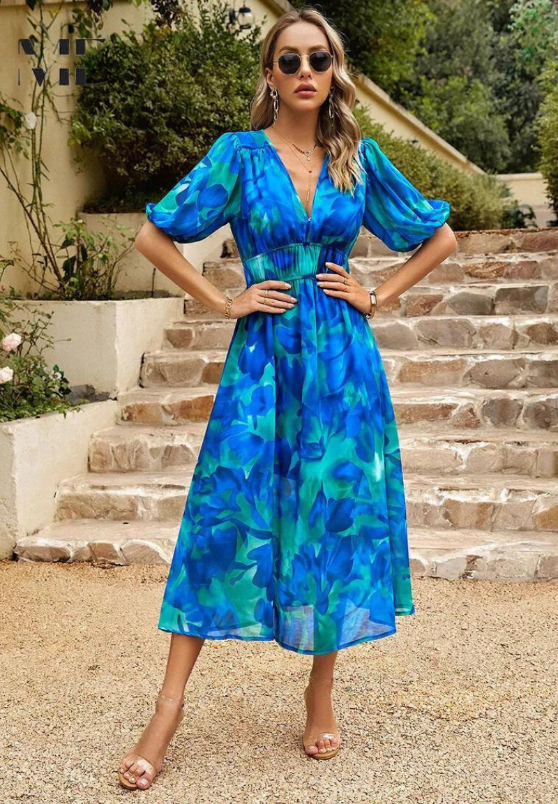 Elegant floral summer dress for women by Harrow, featuring a vibrant pattern and flowing design.