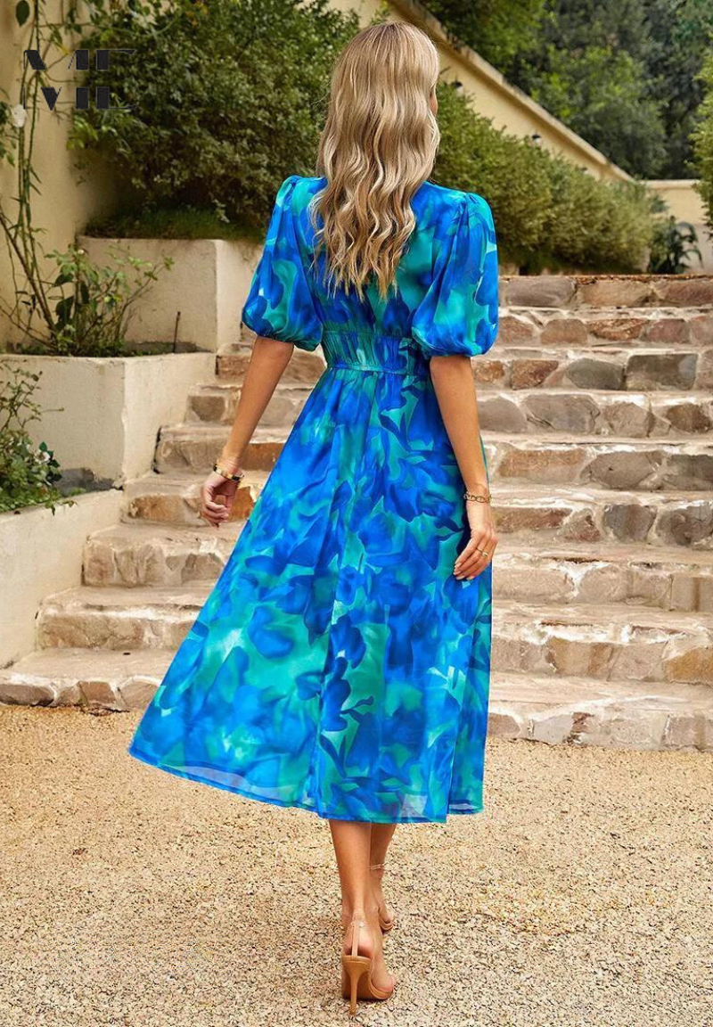 Elegant floral dress for women, the Monica by Harrow, with vibrant summer floral pattern and lightweight fabric.