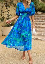 Elegant floral summer dress for women, the Monica dress by Harrow, featuring a vibrant floral pattern and lightweight fabric.