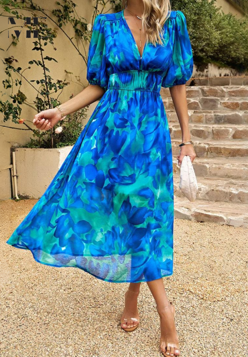 Elegant floral summer dress for women, the Monica dress by Harrow, featuring a vibrant floral pattern and lightweight fabric.