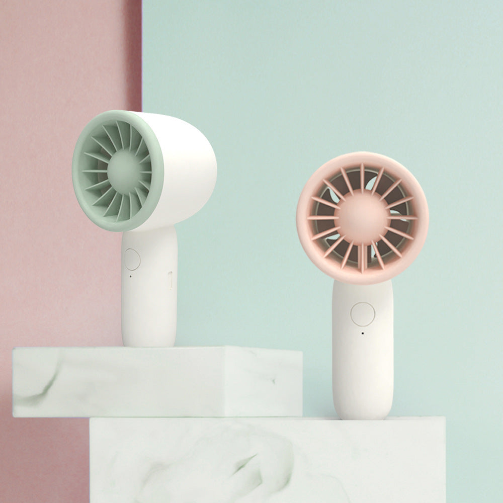 Unisex portable hand fan with closed turbine fan, quiet operation and rechargeable battery