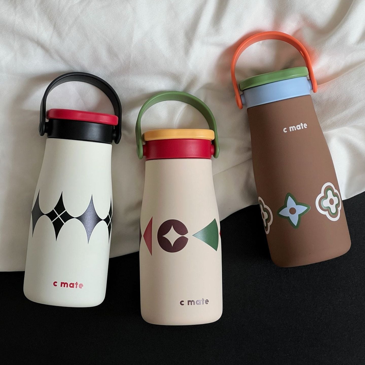 Women’s Ergonomic BPA-Free Plastic Water Bottle with Carrying Handle and Floral Design