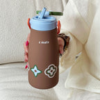 Women’s Ergonomic BPA-Free Plastic Water Bottle with Carrying Handle and Floral Design