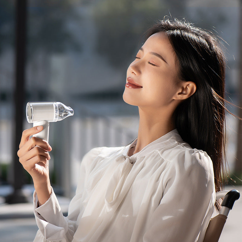 High-Performance Handheld Mini Fan Portable Lightweight with Interchangeable Heads and One-Button Control