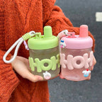 Women’s BPA-Free Plastic Water Bottle with Integrated Carrying Loop and Screw Cap Splash Guard