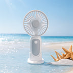 Unisex compact portable hand fan with foldable stand and quiet brushless motor rechargeable