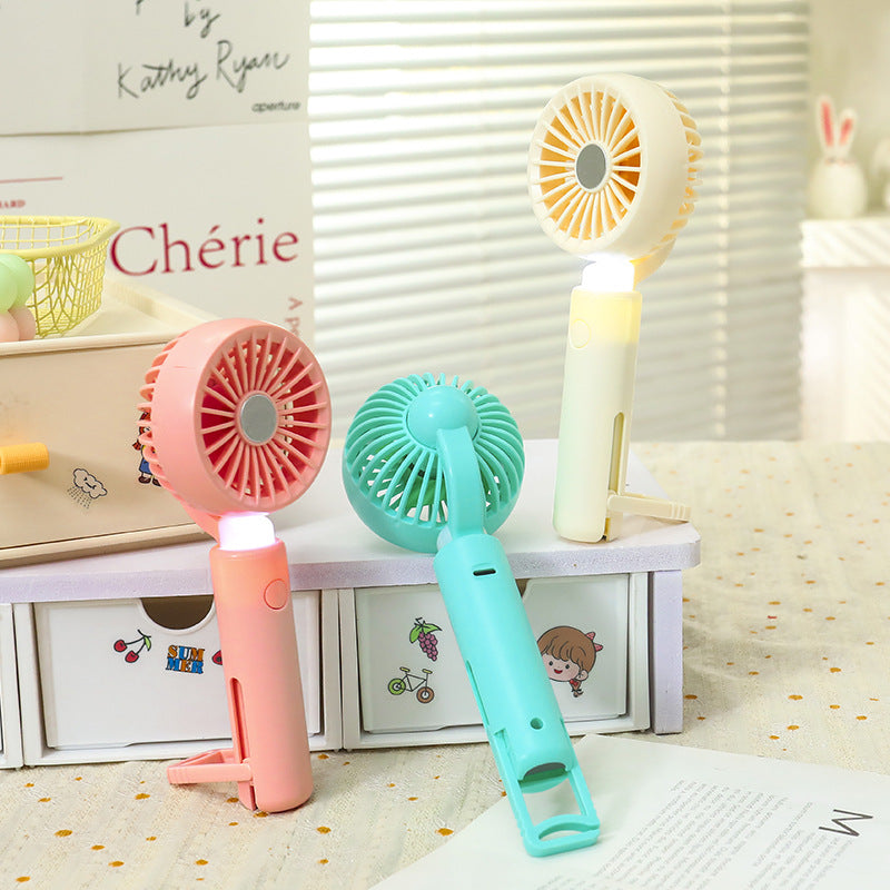 Portable Mini Hand Fan with USB Charging and Integrated LED Light Compact Rechargeable Personal Fan