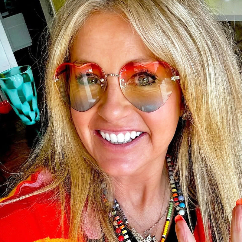 Women’s Heart-Shaped Sunglasses with Mirrored Lenses and Metal Frame UV Protection