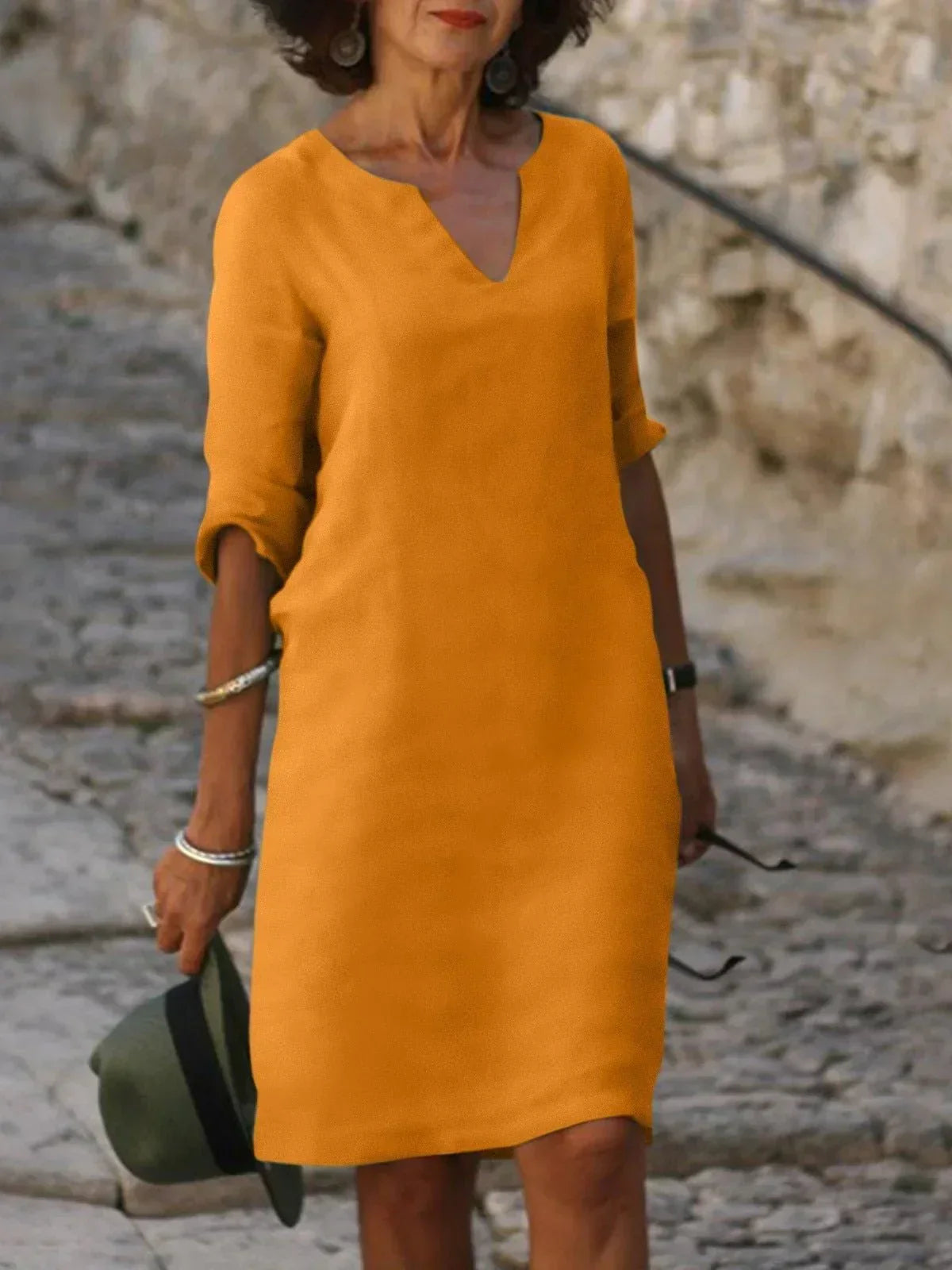 Elegant Skylar V-neck dress for women in summer, featuring a flowy design and lightweight fabric by Harrow.