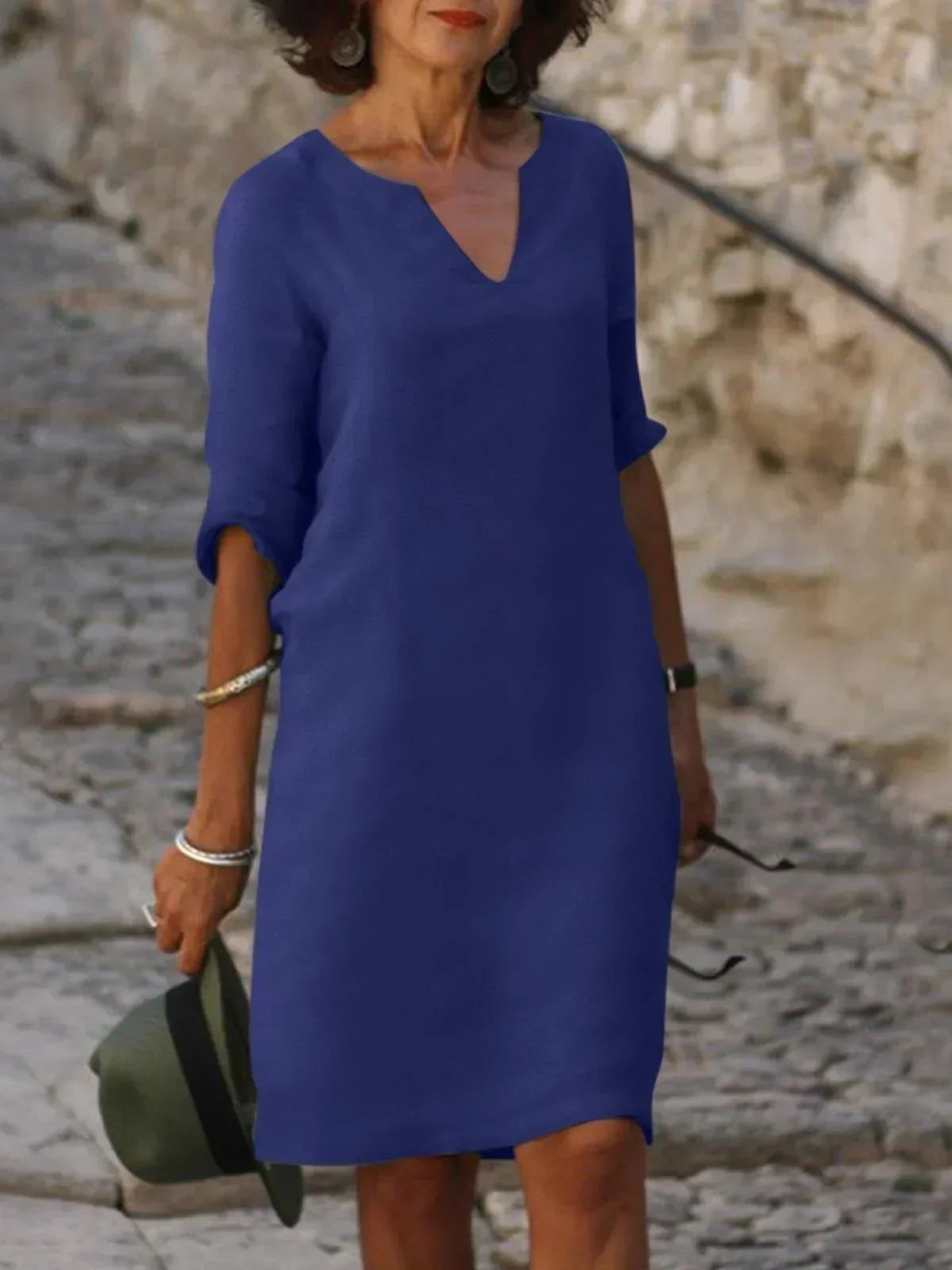 Elegant Skylar V-neck dress for women in summer, featuring a flowing design and lightweight fabric, by Harrow.