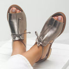 Harrow Stella metallic flat sandals for women with open toe, bow tie strap, stylish summer footwear.