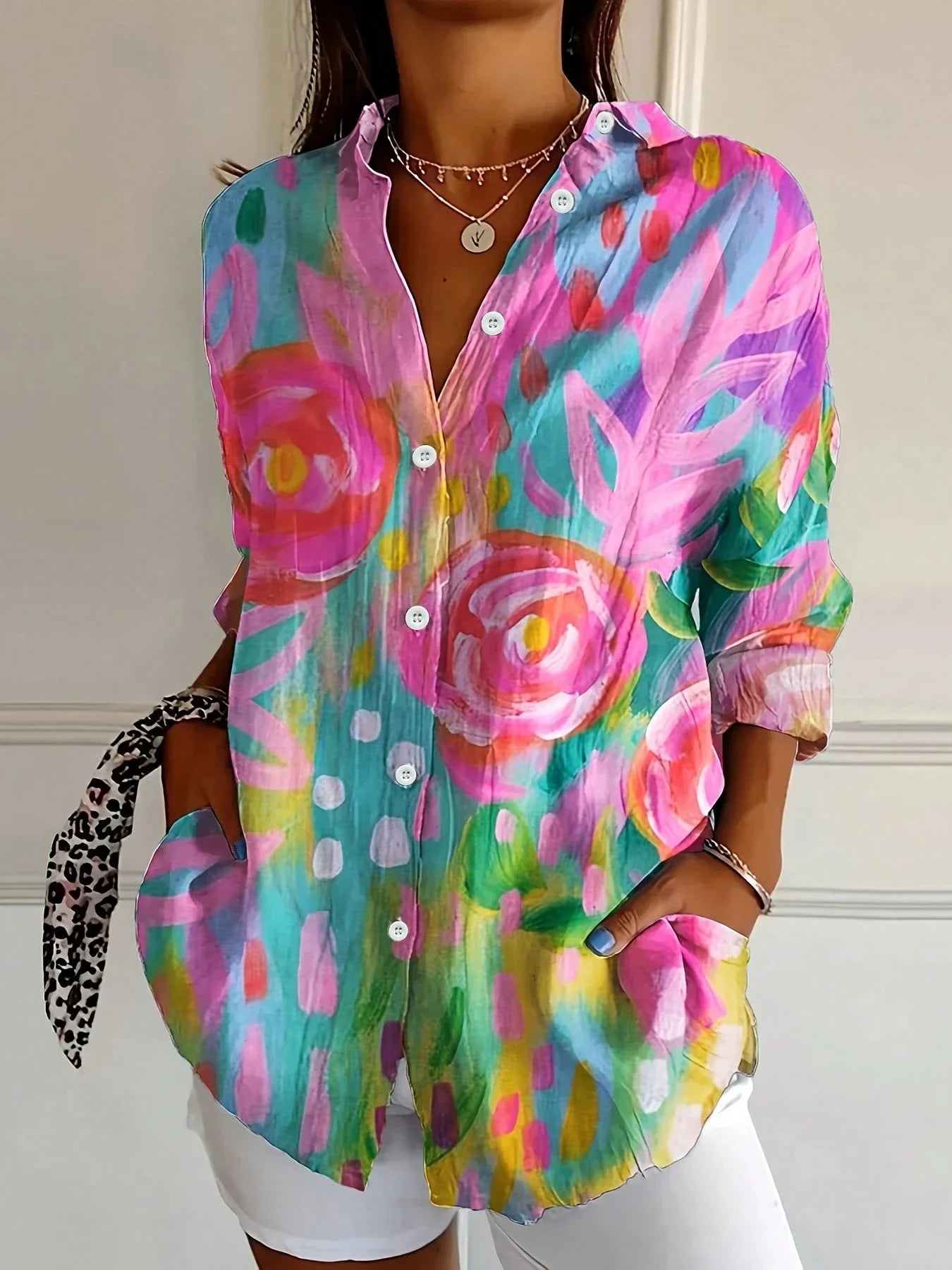 Vibrant floral linen blouse for women by Harrow, featuring a playful print and lightweight summer apparel.