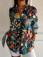 Vibrant floral linen blouse for women by Harrow, featuring playful print and lightweight summer apparel design.
