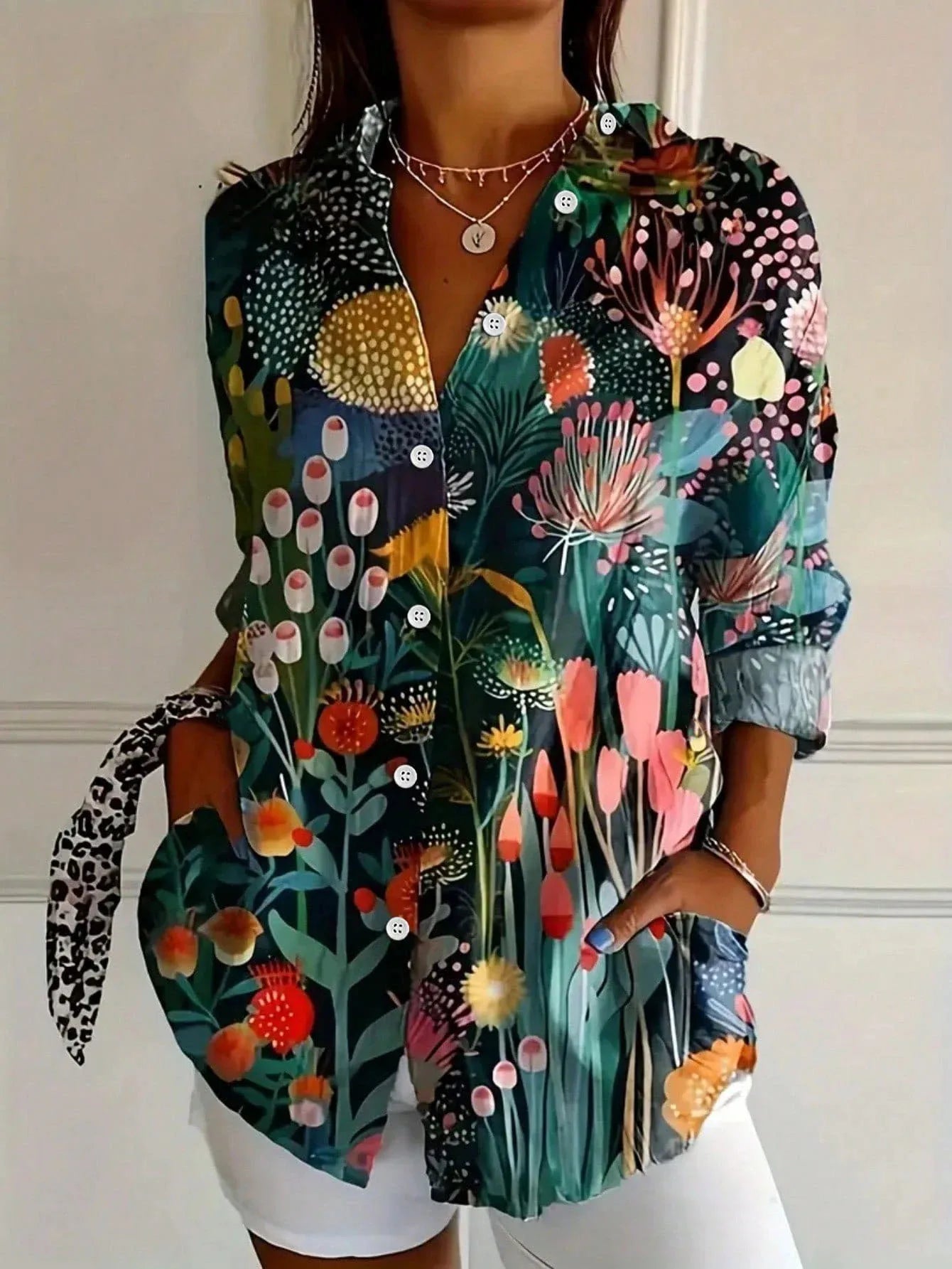 Vibrant floral linen blouse for women by Harrow, featuring playful print and lightweight summer apparel design.
