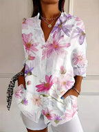 Vibrant floral linen blouse for women by Harrow, featuring a playful print and lightweight summer apparel design.
