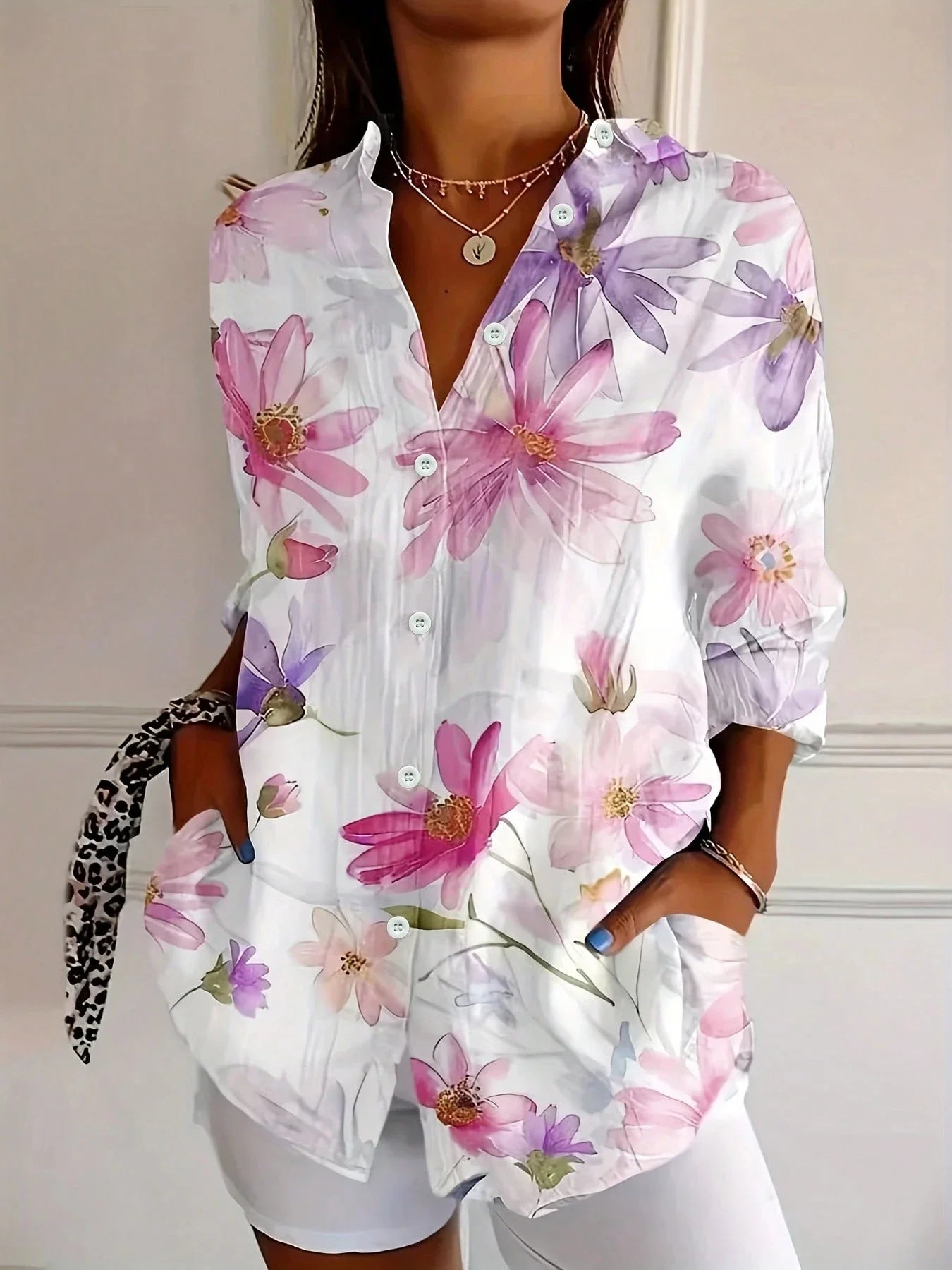 Vibrant floral linen blouse for women by Harrow, featuring a playful print and lightweight summer apparel design.