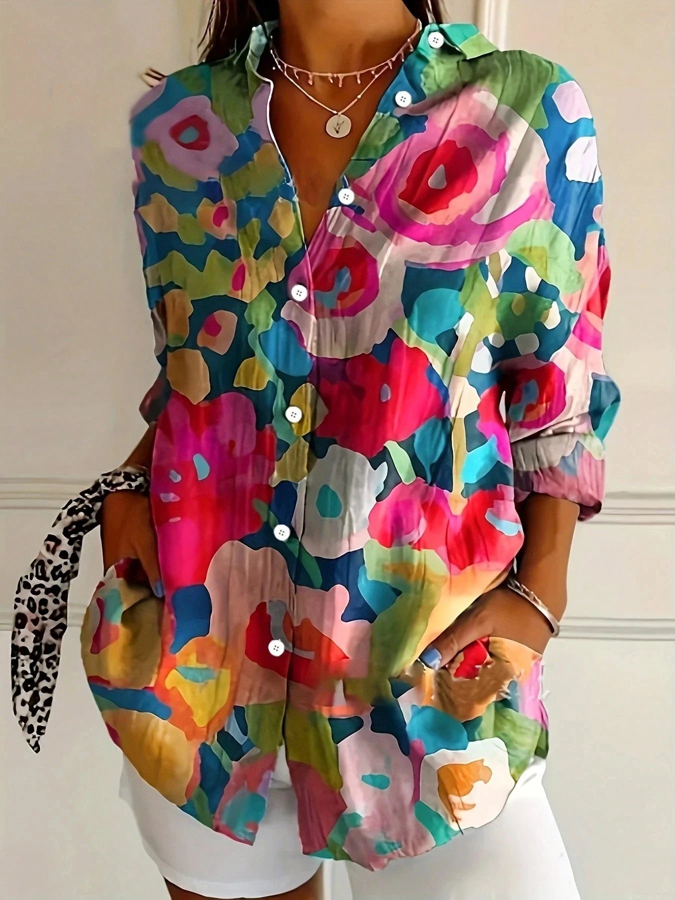 Vibrant floral linen blouse for women by Harrow, featuring a playful print and summer-ready lightweight fabric.