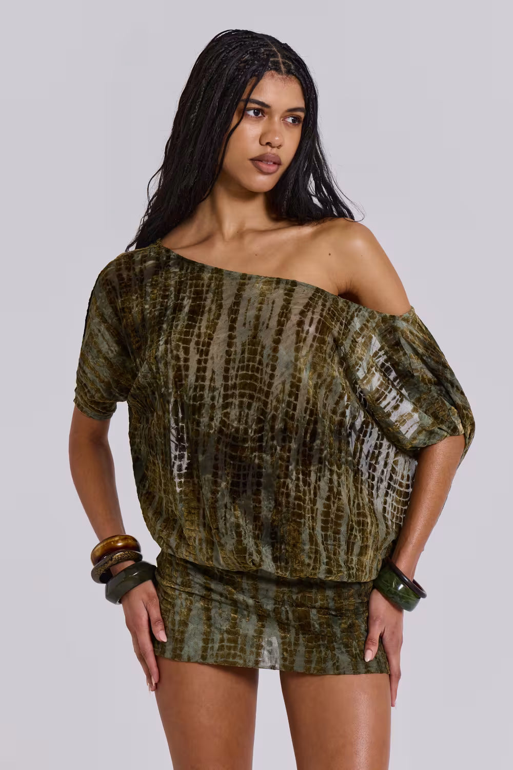 Women wearing the Adriana Harrow romantic off-shoulder mini dress for cocktail parties, featuring a backless design and elegant style.