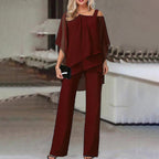 Women wearing the Agnes cold shoulder wide-leg jumpsuit set by Harrow, featuring batwing sleeves and stylish design.