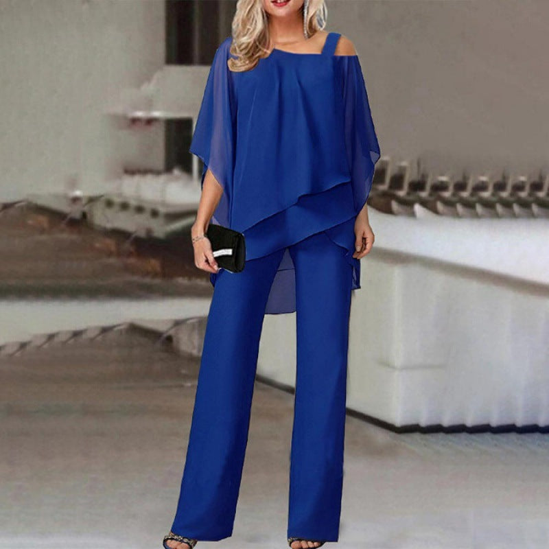 Women wearing Harrow Agnes cold shoulder jumpsuit with wide legs, featuring batwing sleeves and a stylish, elegant design.