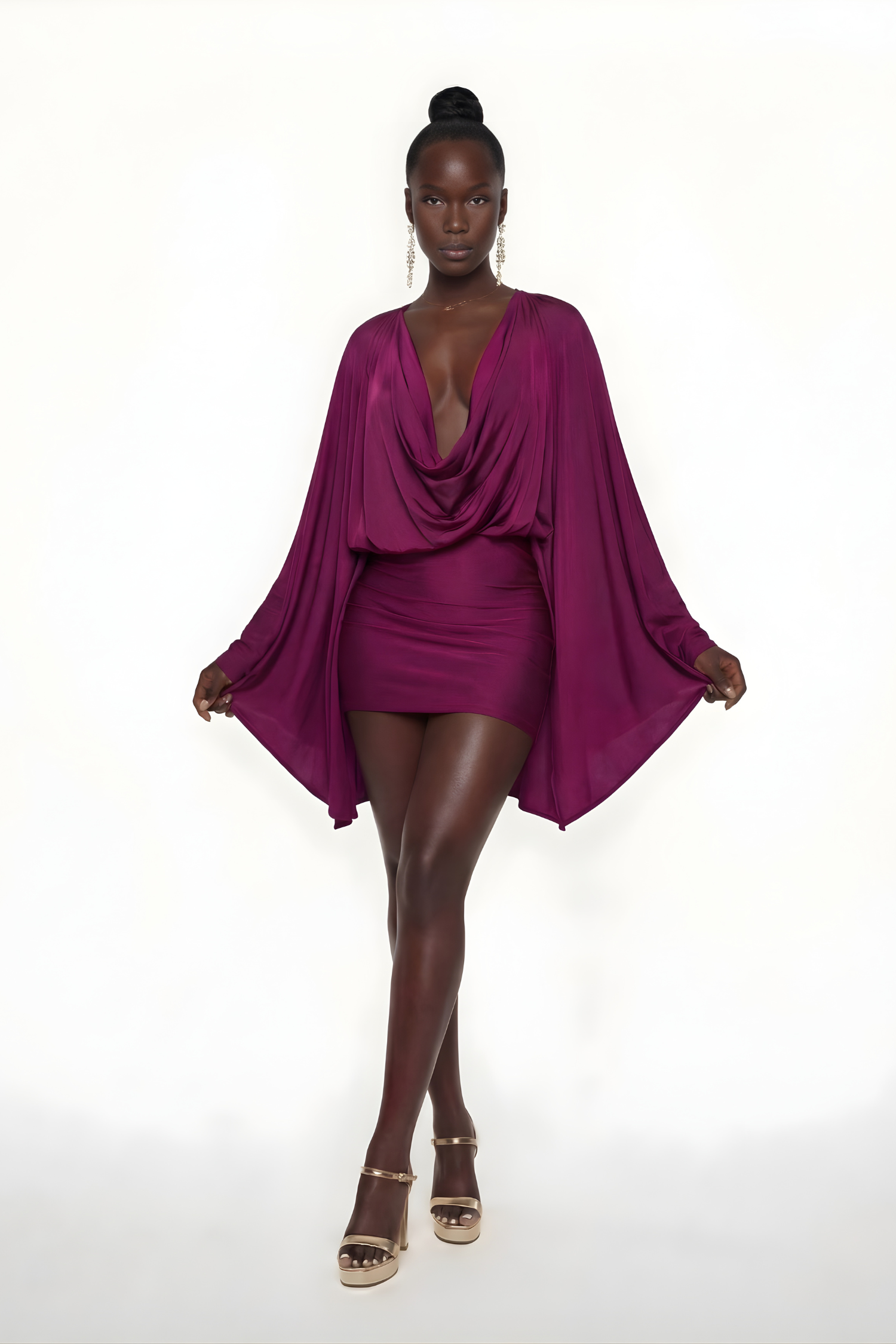 Elegant black mini dress by Harrow featuring draped fabric, cowl neck, and batwing sleeves, perfect for cocktail parties.
