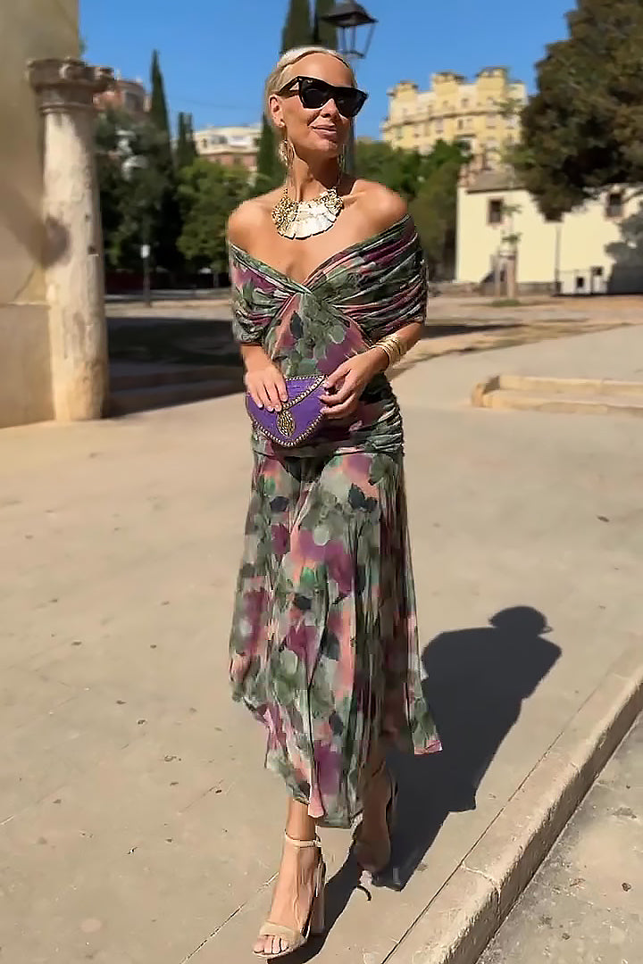 Women wearing the Harrow Amira floral maxi dress with off-shoulder design, perfect for cocktail parties, showcasing a dreamy floral pattern.
